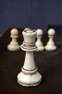 Close-up of chess pieces on table