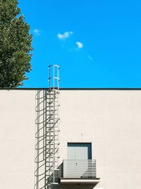 Low angle view of building against blue sky