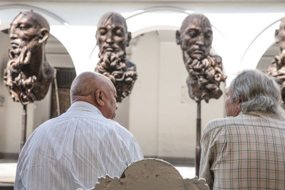 Close-up of woman against wall