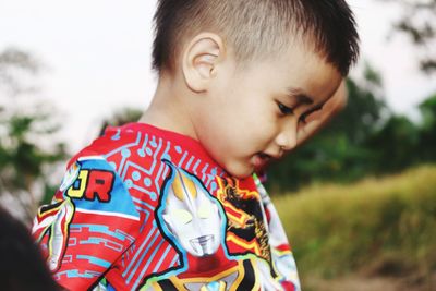 Close-up of cute boy playing outdoors