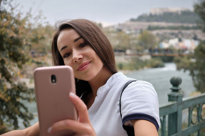 Young woman using mobile phone