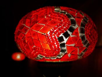 Close-up of illuminated ball against black background