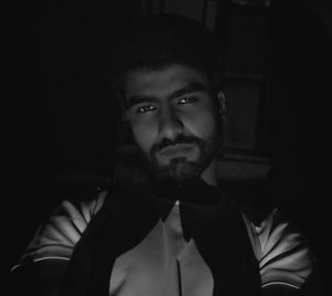 Portrait of young man in darkroom