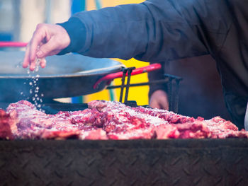 Midsection of person preparing food