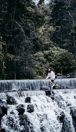 Man sitting in forest