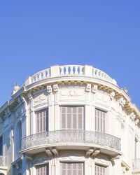 Low angle view of building against blue sky