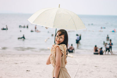 Woman standing at beach