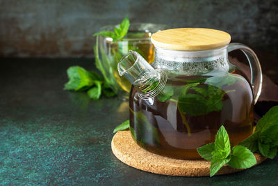 Close-up of drink in glass jar on table