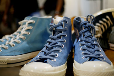 Close-up of shoes hanging on rack