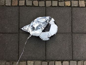 High angle view of umbrella on footpath