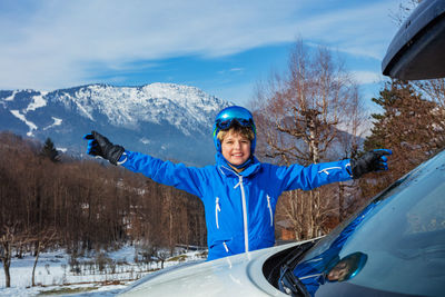Rear view of man skiing on snow covered mountain