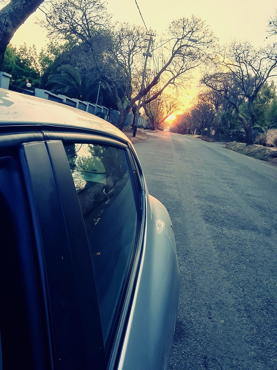 ROAD SEEN THROUGH CAR WINDSHIELD