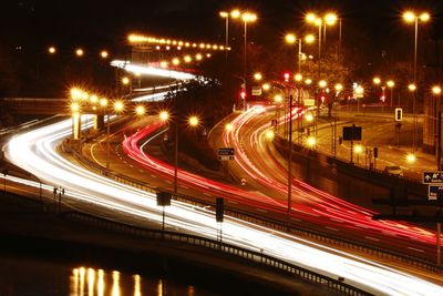 High angle view of light trails on road at night