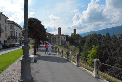 People walking on road in city