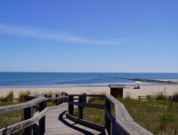Scenic view of sea against blue sky