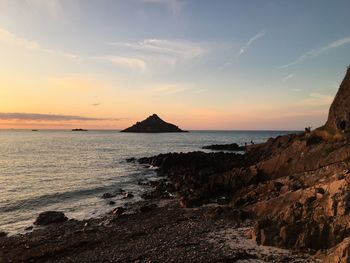 Scenic view of sea against sky during sunset