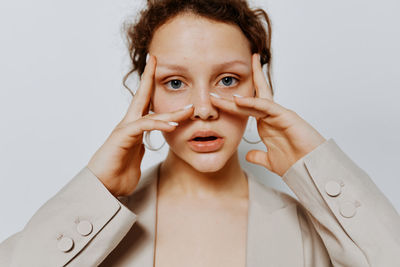 Portrait of teenager girl against wall