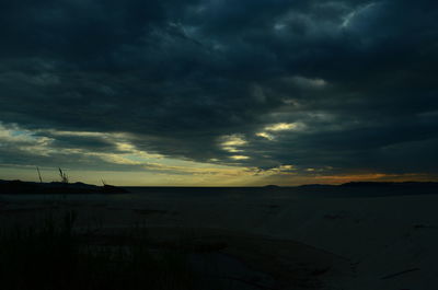 Scenic view of dramatic sky over land