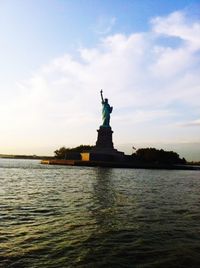 Statue of liberty against cloudy sky