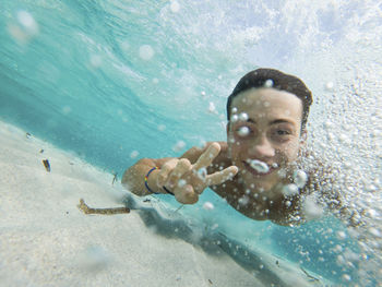 Portrait of man swimming in sea