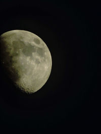 Low angle view of moon against clear sky at night