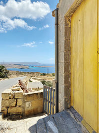 Scenic view of sea against buildings