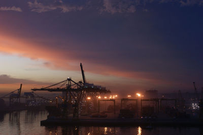View of harbor at sunset