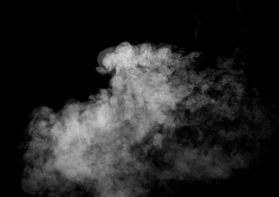 Close-up of smoke against black background