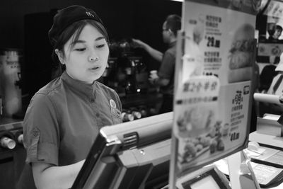 Portrait of a girl looking at store
