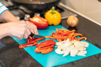 Man preparing food on cutting board