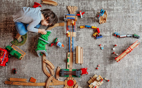 Boy playing with toy at home