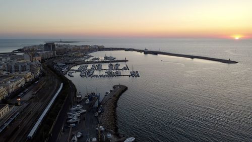 High angle view of beach against sky during sunset