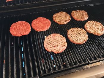 High angle view of meat on barbecue grill