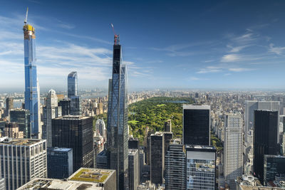 Modern buildings in city against sky