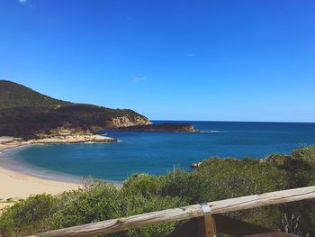 Scenic view of sea against clear blue sky