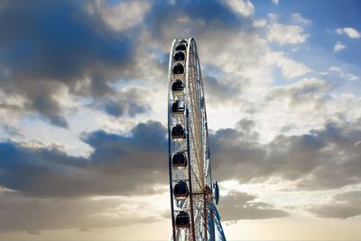 Low angle view of ferris wheel against sky