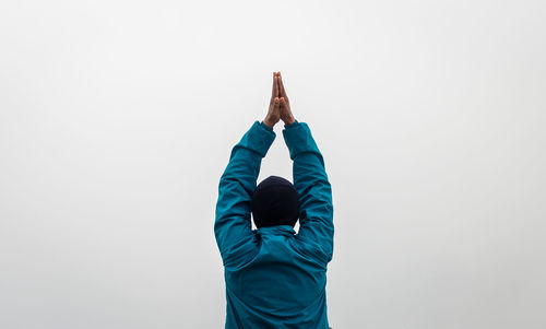 Man meditating with white mist background from flat angle