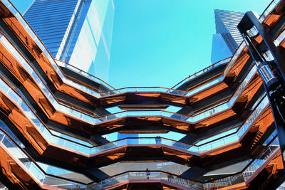 Low angle view of modern building against clear blue sky