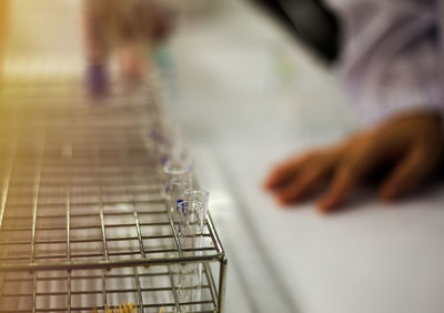 Close-up of test tube in metallic rack on table in laboratory