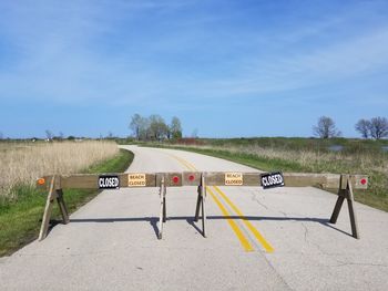 Text on road against sky