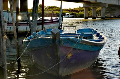 Boats moored on sea against sky