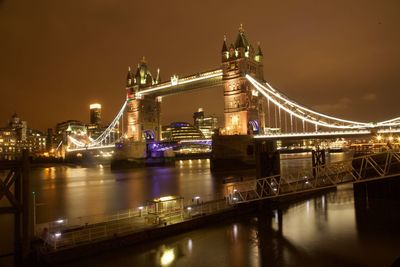 Illuminated suspension bridge at night