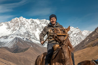 Portrait of man standing on mountain