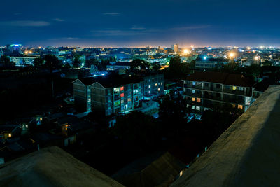 High angle view of illuminated buildings in city at night
