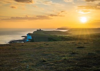 Scenic view of sea against sky during sunset