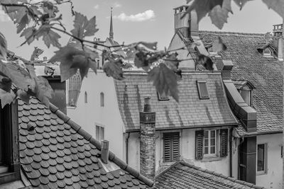 Houses against cloudy sky