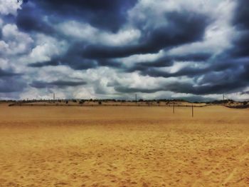 Scenic view of landscape against cloudy sky