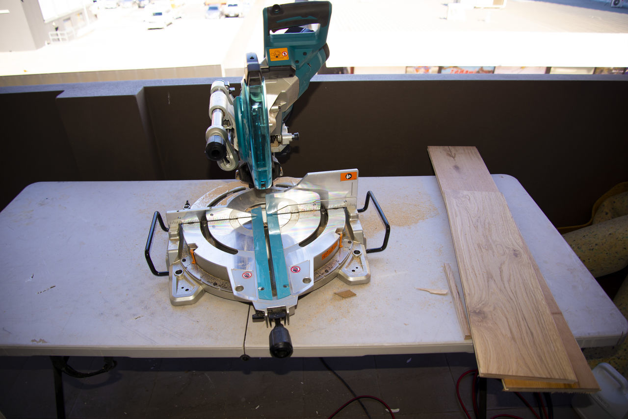 HIGH ANGLE VIEW OF MACHINE ON TABLE AT SIDEWALK