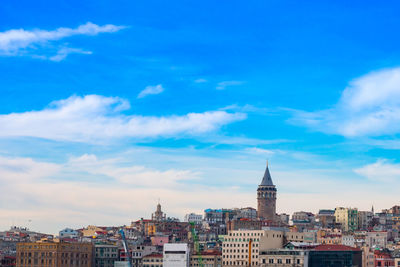 View of buildings against blue sky