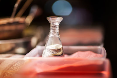 Decorative glass bottles with colored sand inside, sand souvenirs